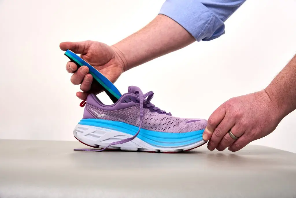 Podiatrist fitting custom orthoses for a patient at Precision Gait Clinic, Bramhall